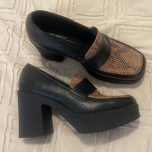 Anthropologie black/snake booties